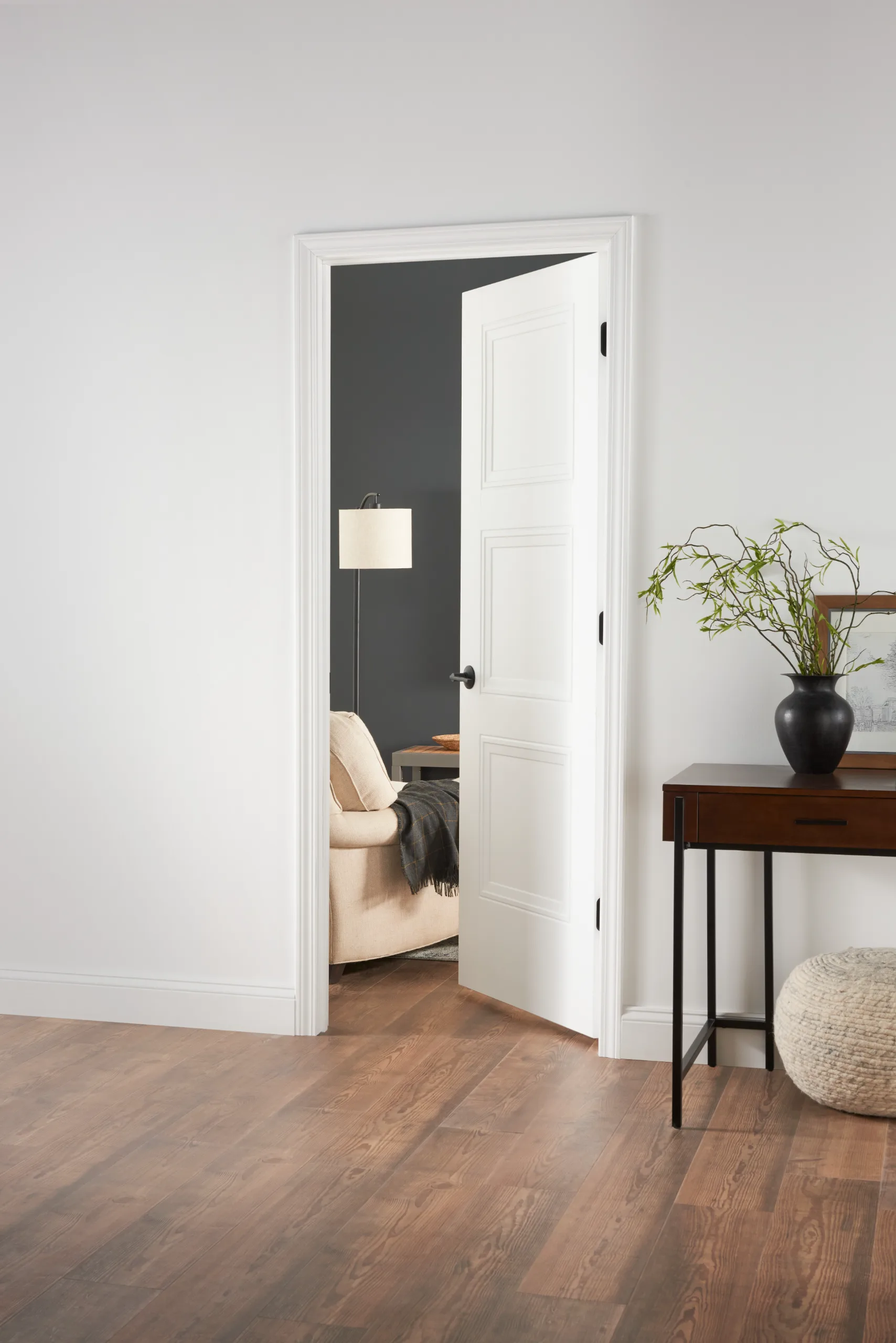 A painted three panel interior door standing open