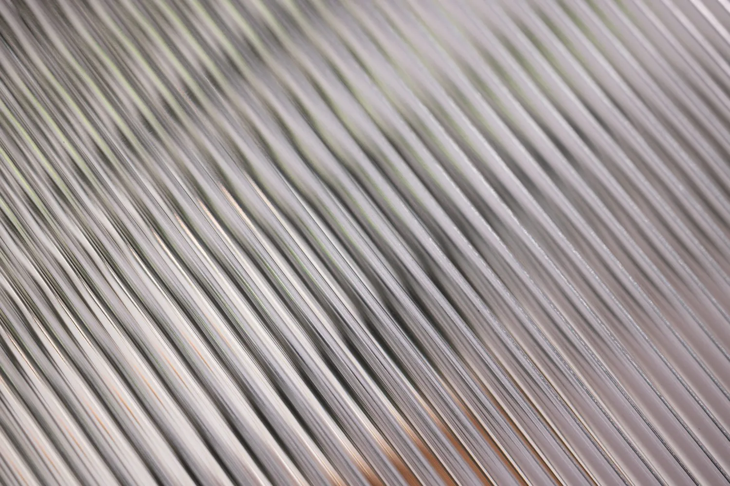Close-up of ODL Wide Reed glass, showing broad reeded channels running the height of the lite