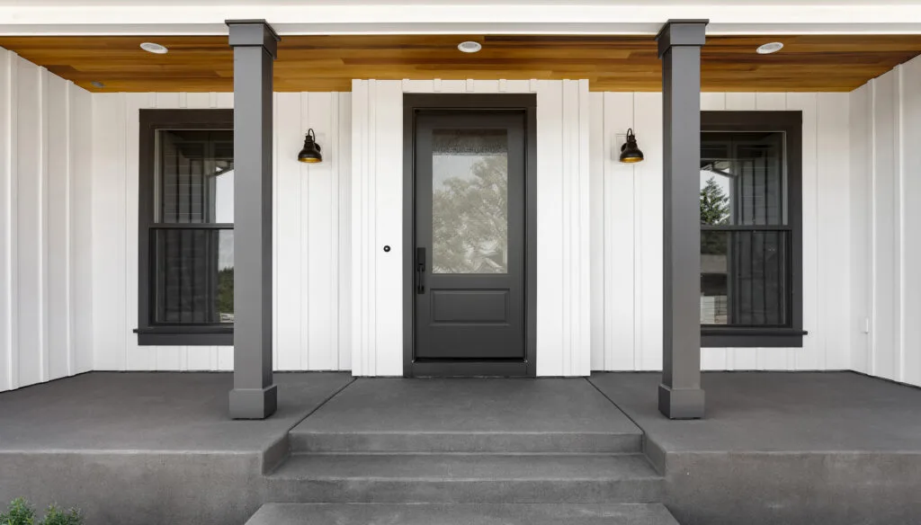 Plastpro DRB1E ONYX three quarter lite entry door with rain glass on a board and batten porch