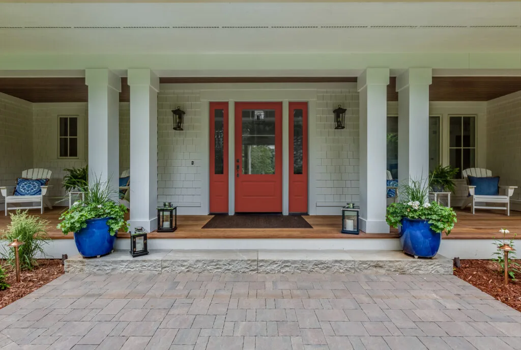 Plastpro DRS1E entry door in red with two SLS1E sidelites on a shingled porch