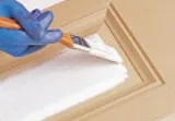 Primer brushed onto a smooth fiberglass door panel
