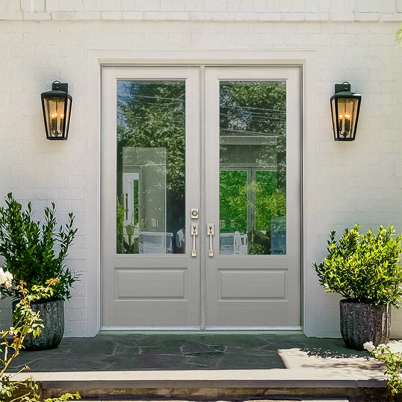A gray Plastpro Nova 90 three quarter lite fiberglass double entry door on a white brick home