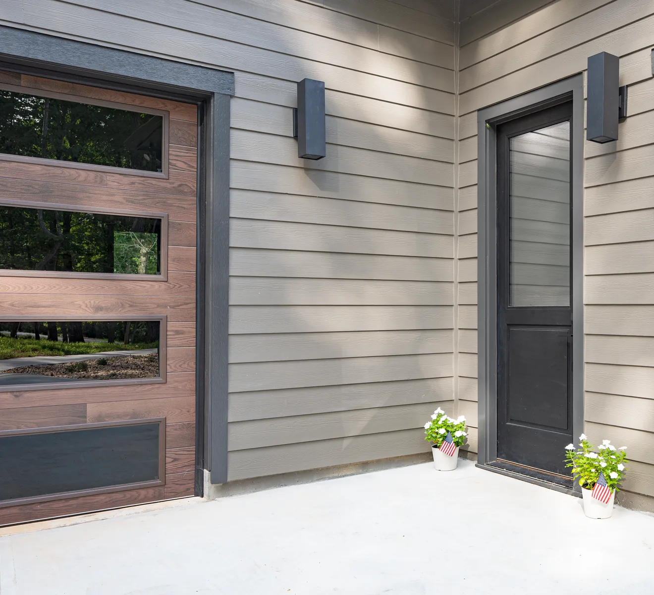 Plastpro half-lite entry door in black on a modern porch