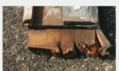 A traditional wood door frame after ground exposure, rotted and split at the bottom