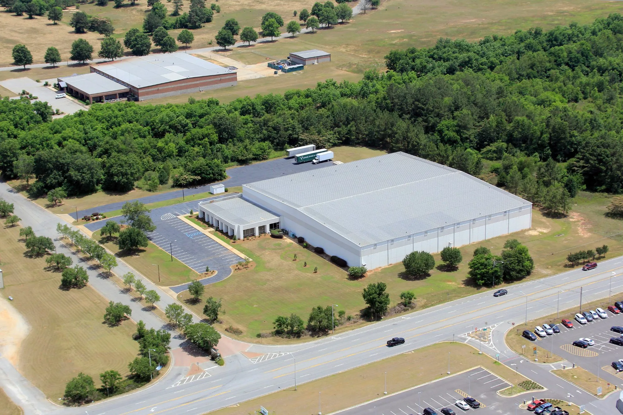 Aerial view of the Tucker Albany facility, its dock apron, and the highway frontage