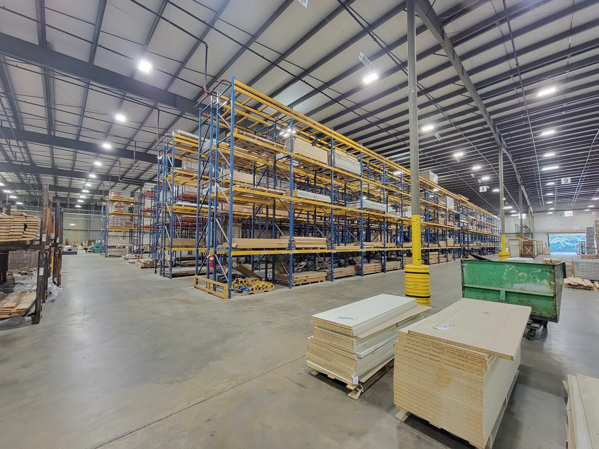Pallet racking holding doors and millwork inside the Albany warehouse