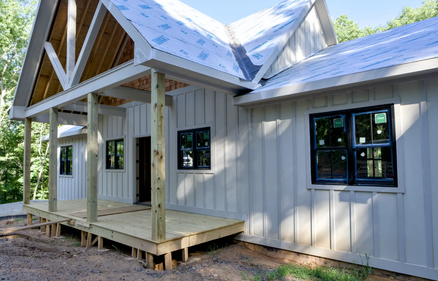 Black Tucker windows set into open framing on a house under construction
