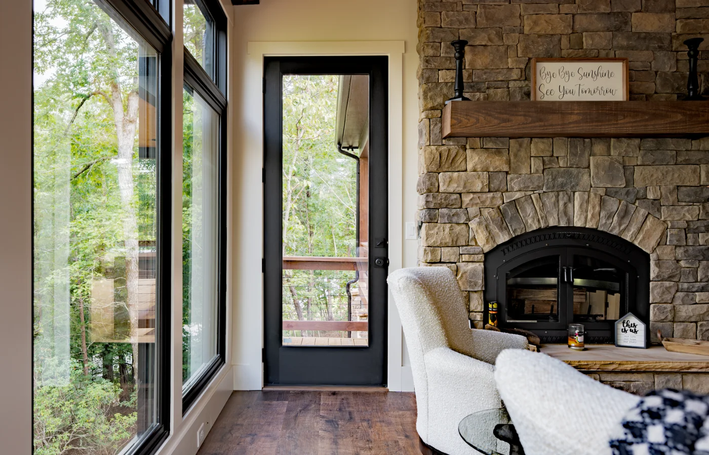 A Plastpro Nova 90 flush glazed entry door beside a stone fireplace
