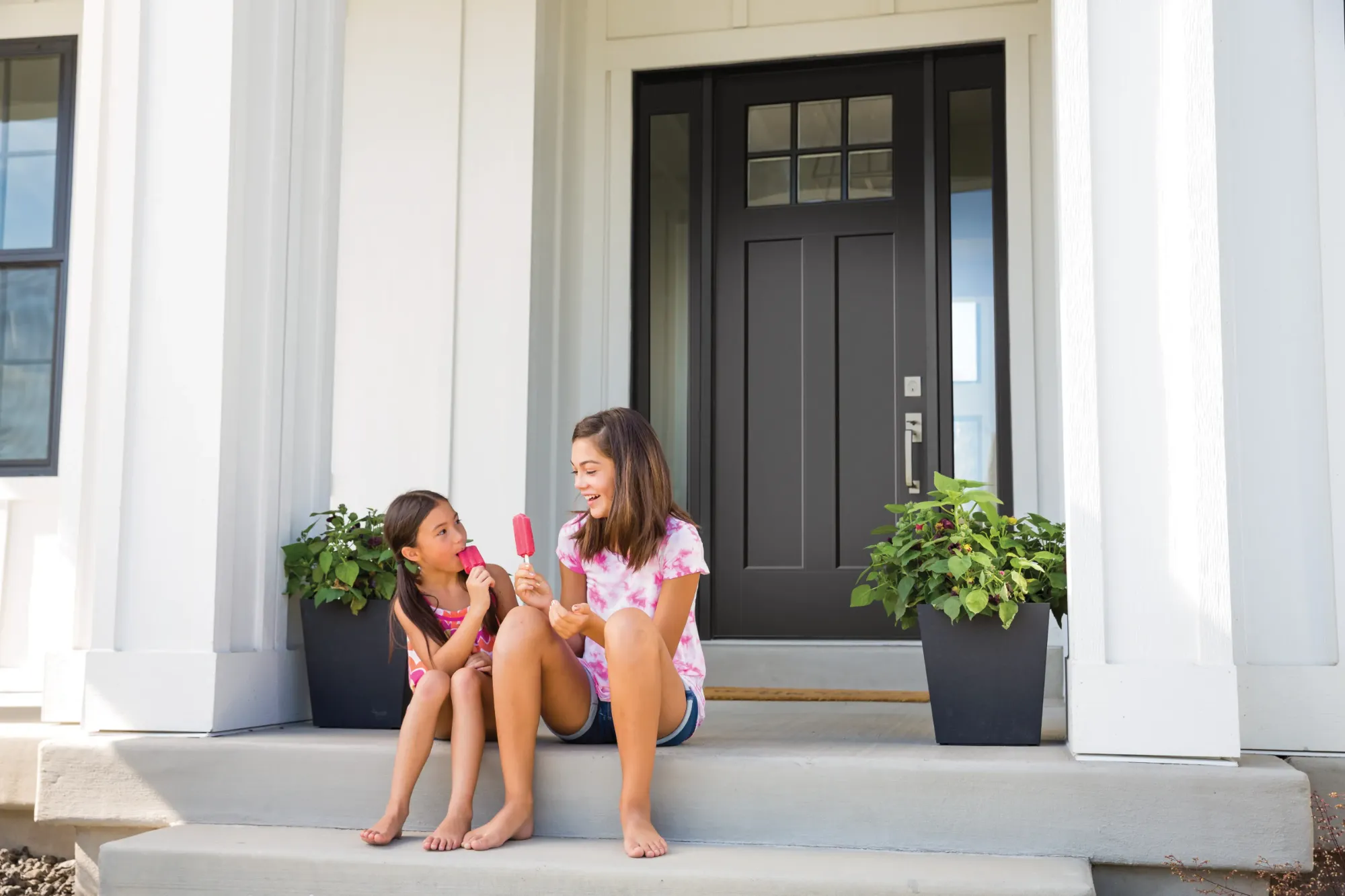 A black Masonite craftsman entry door