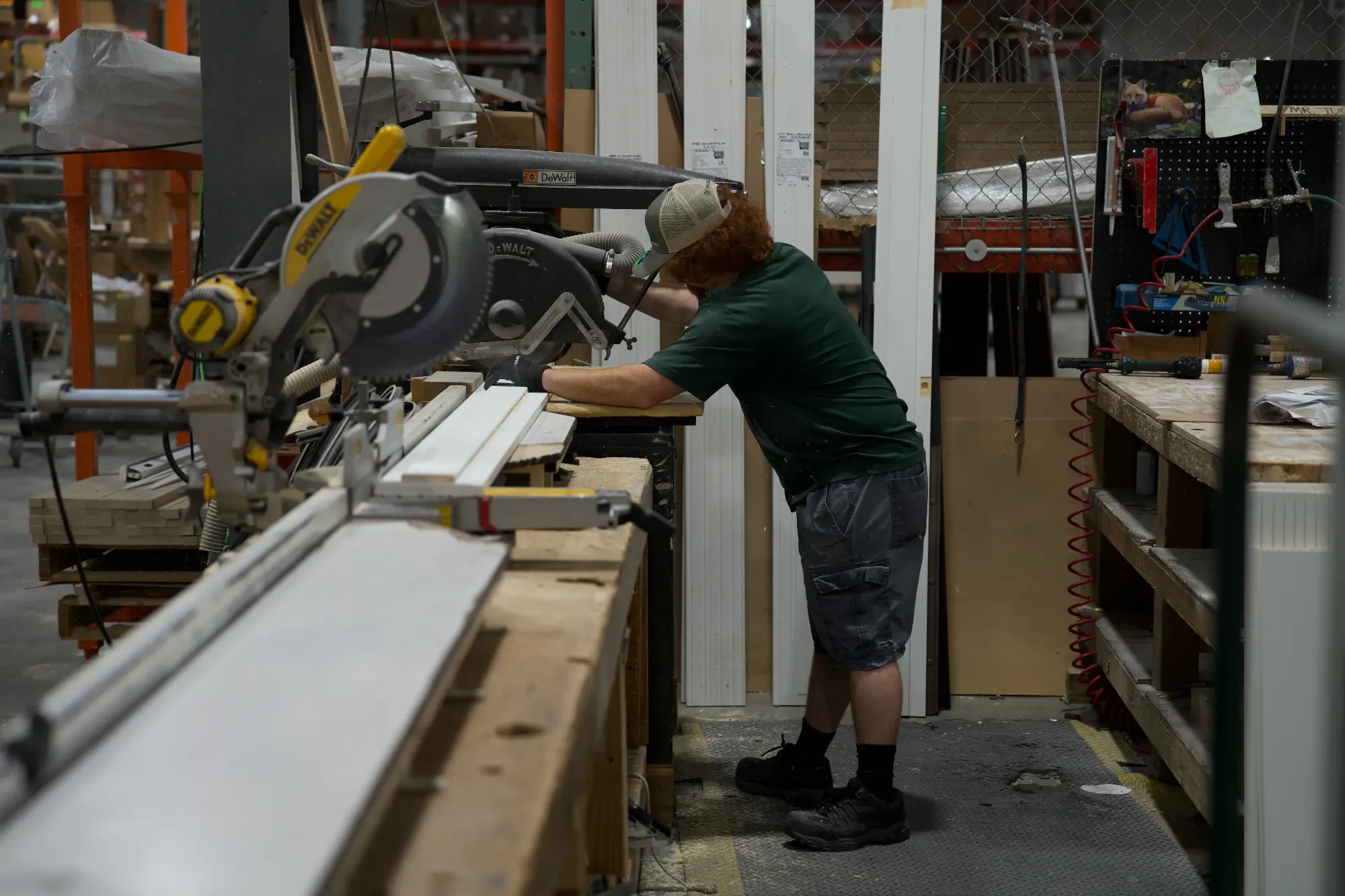 A Tucker millworker fitting hardware to a prehung door unit