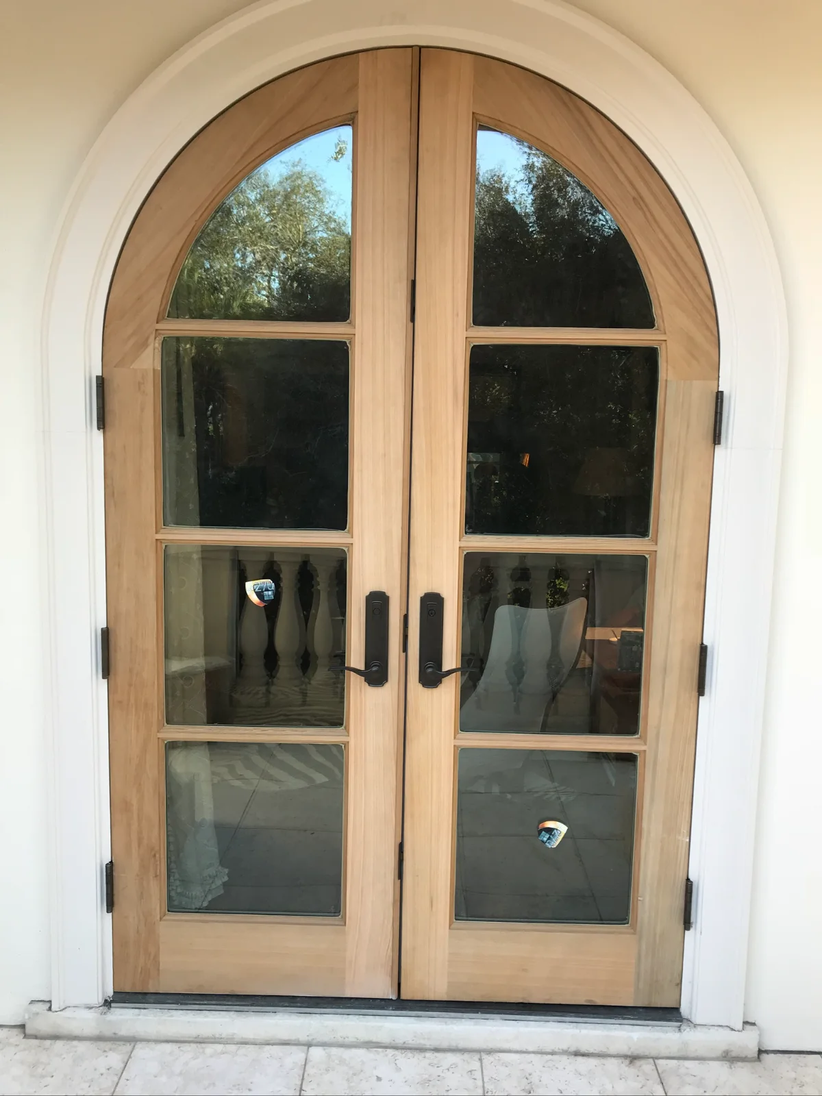 A radius top double entry door with matching sidelites