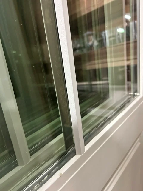 Custom putty colored SDL bars applied along the glass line of a door