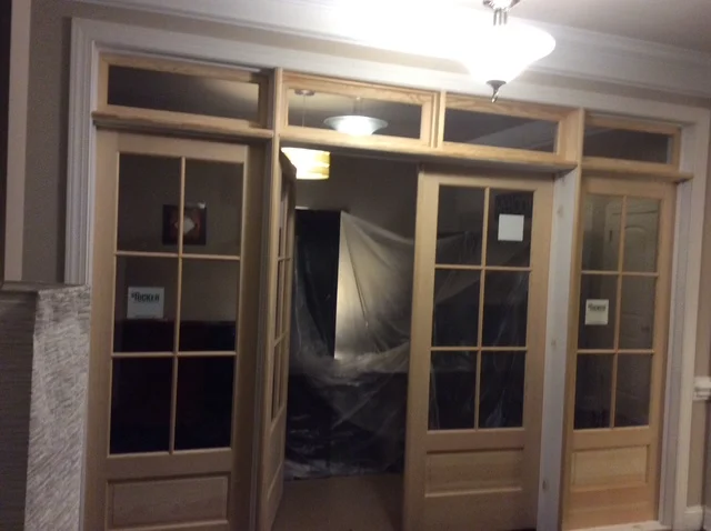 Interior SDL doors with transoms seen from the hallway