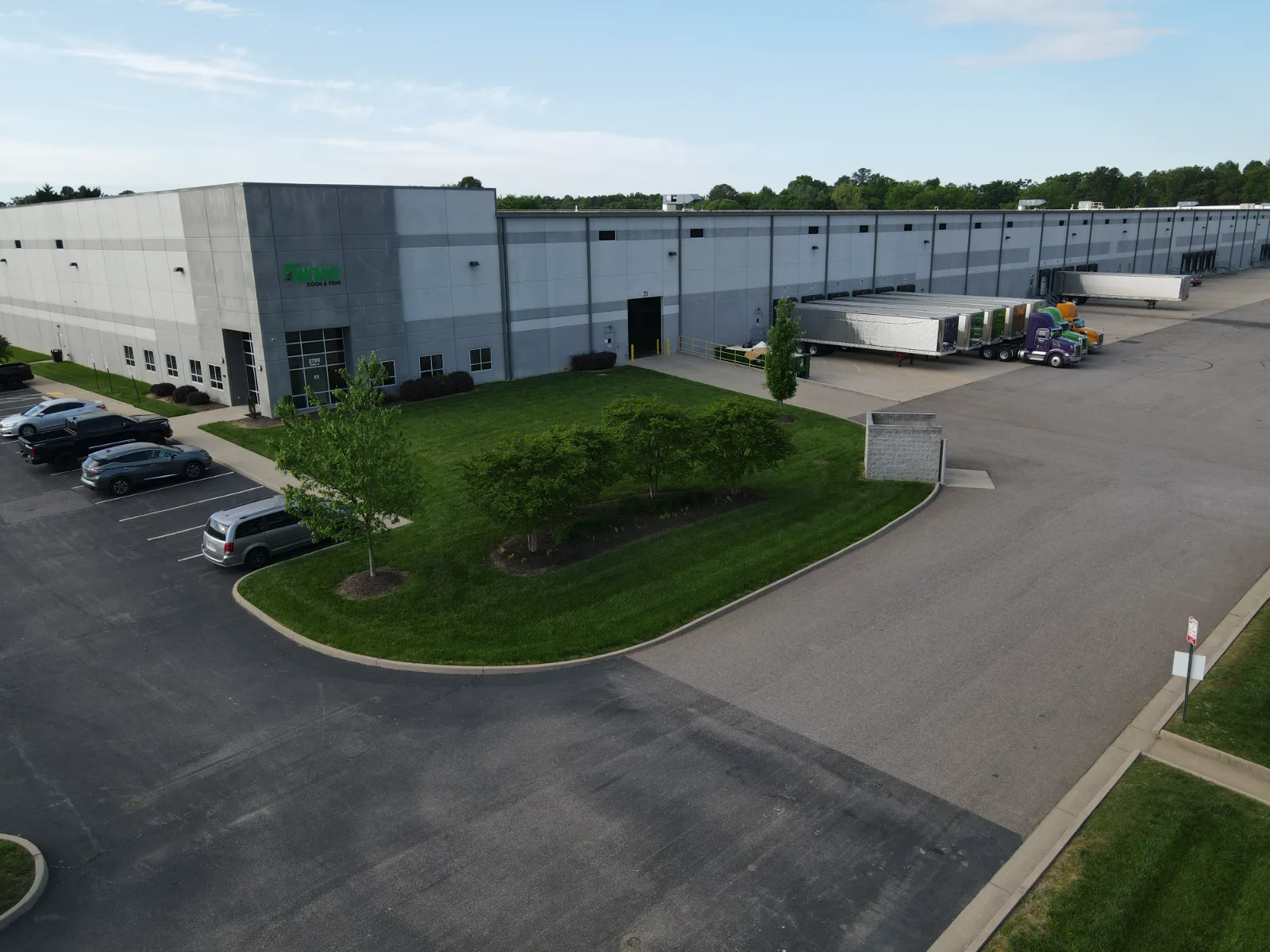 The dock side of the Tucker Richmond building with trailers at the doors