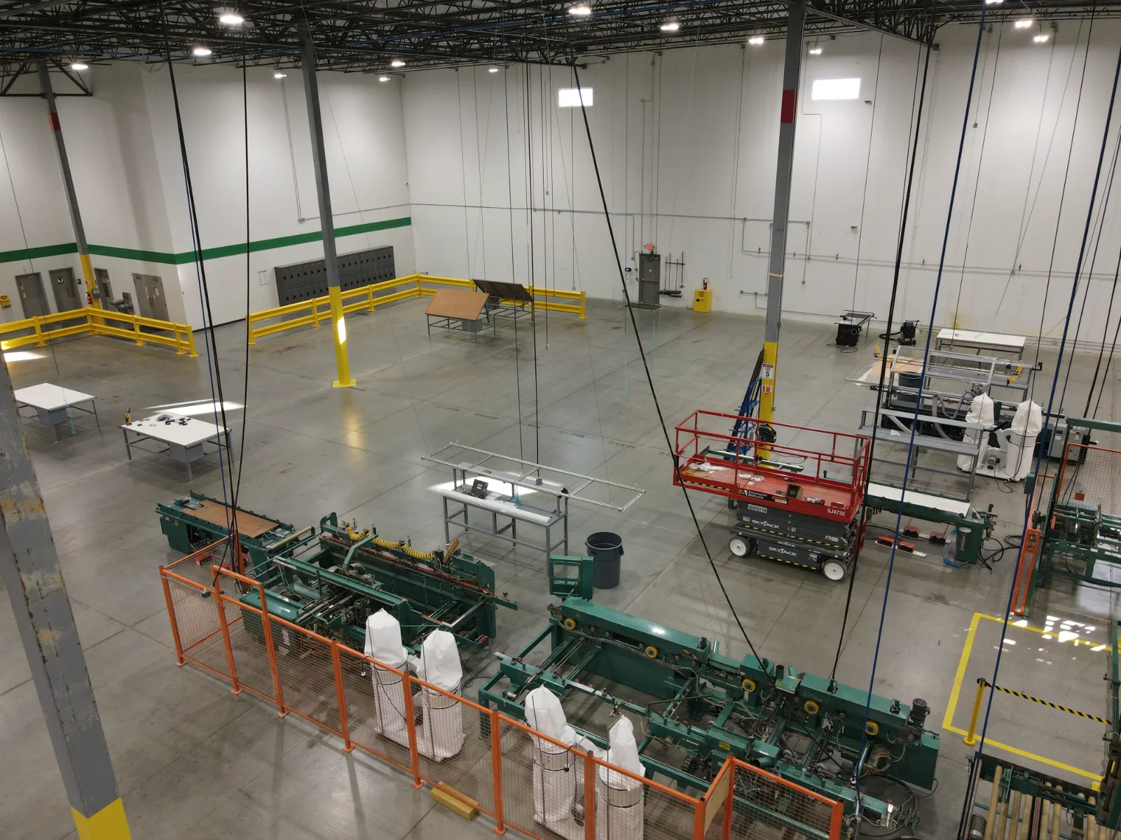 The open floor of the Tucker Richmond warehouse, with the machine line running down the middle