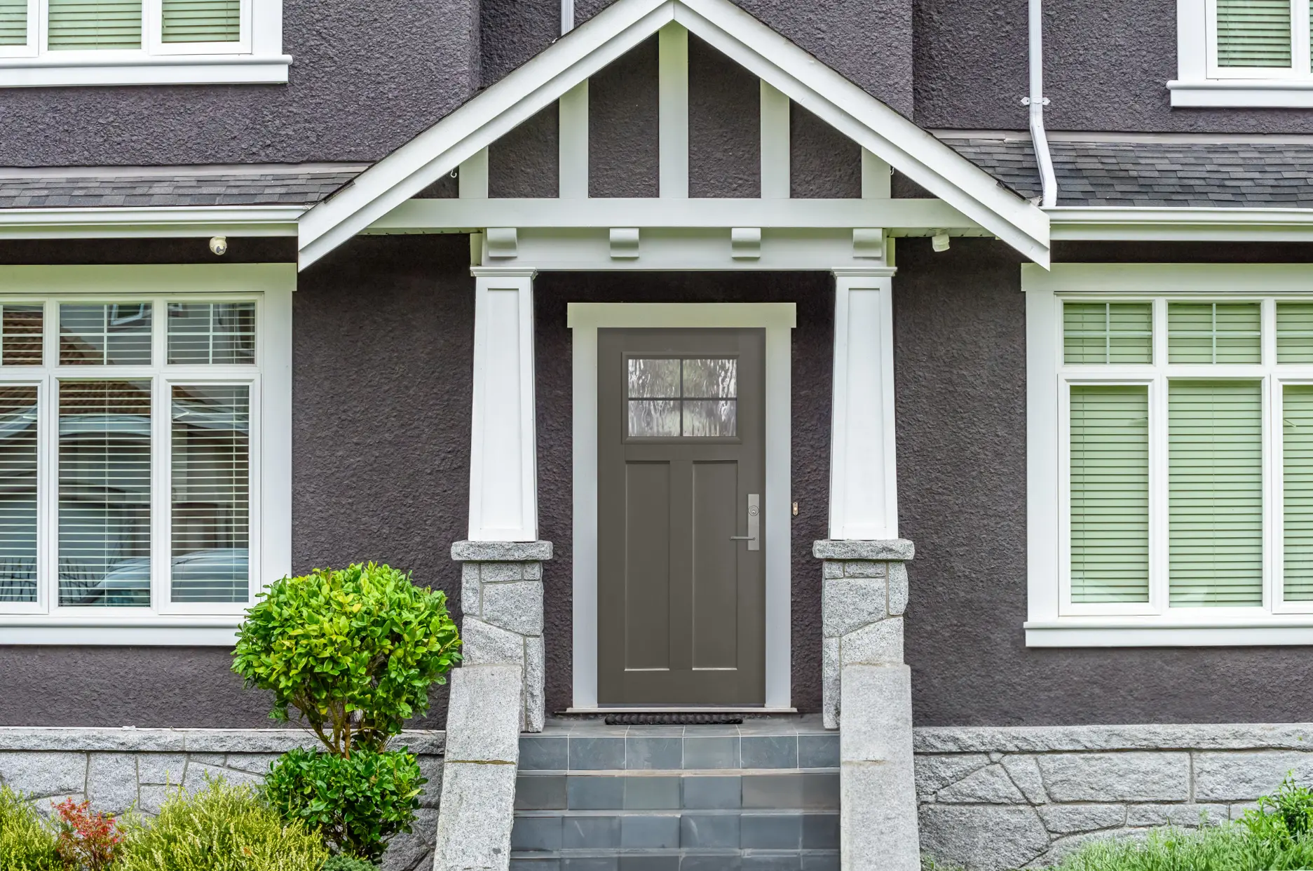 GlassCraft Crafts 4-lite entry on dark grey stucco