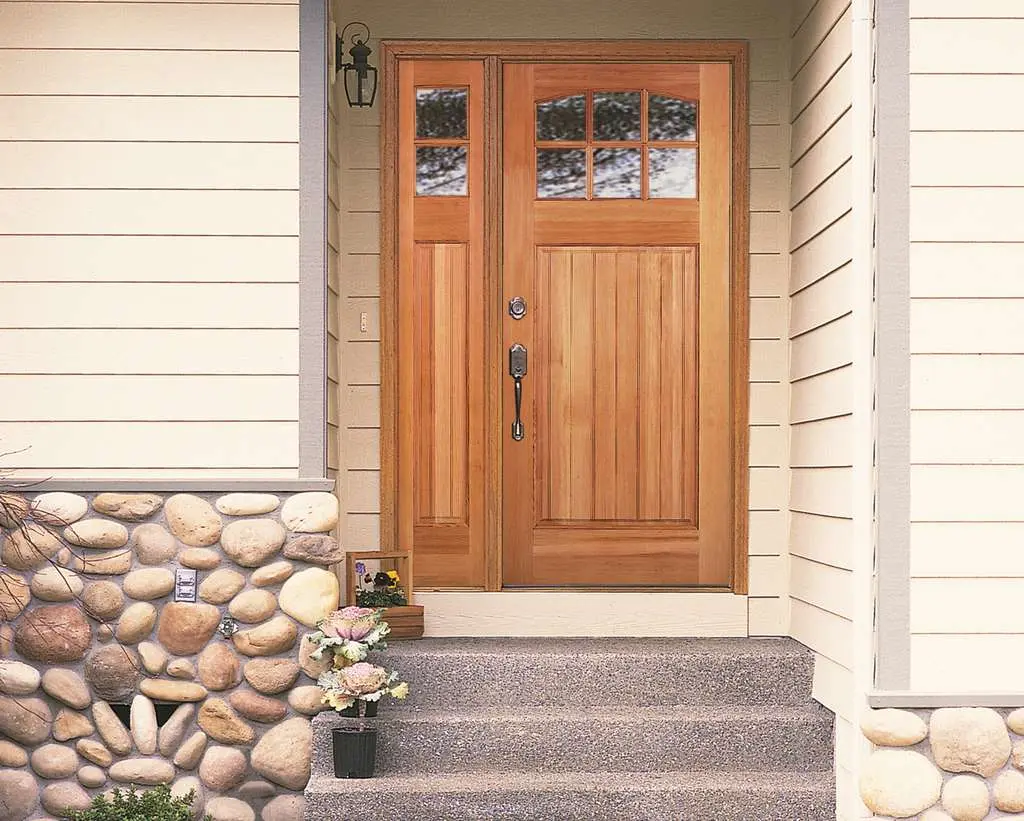 A Rogue Valley Door 4661 VA wood door with matching sidelite