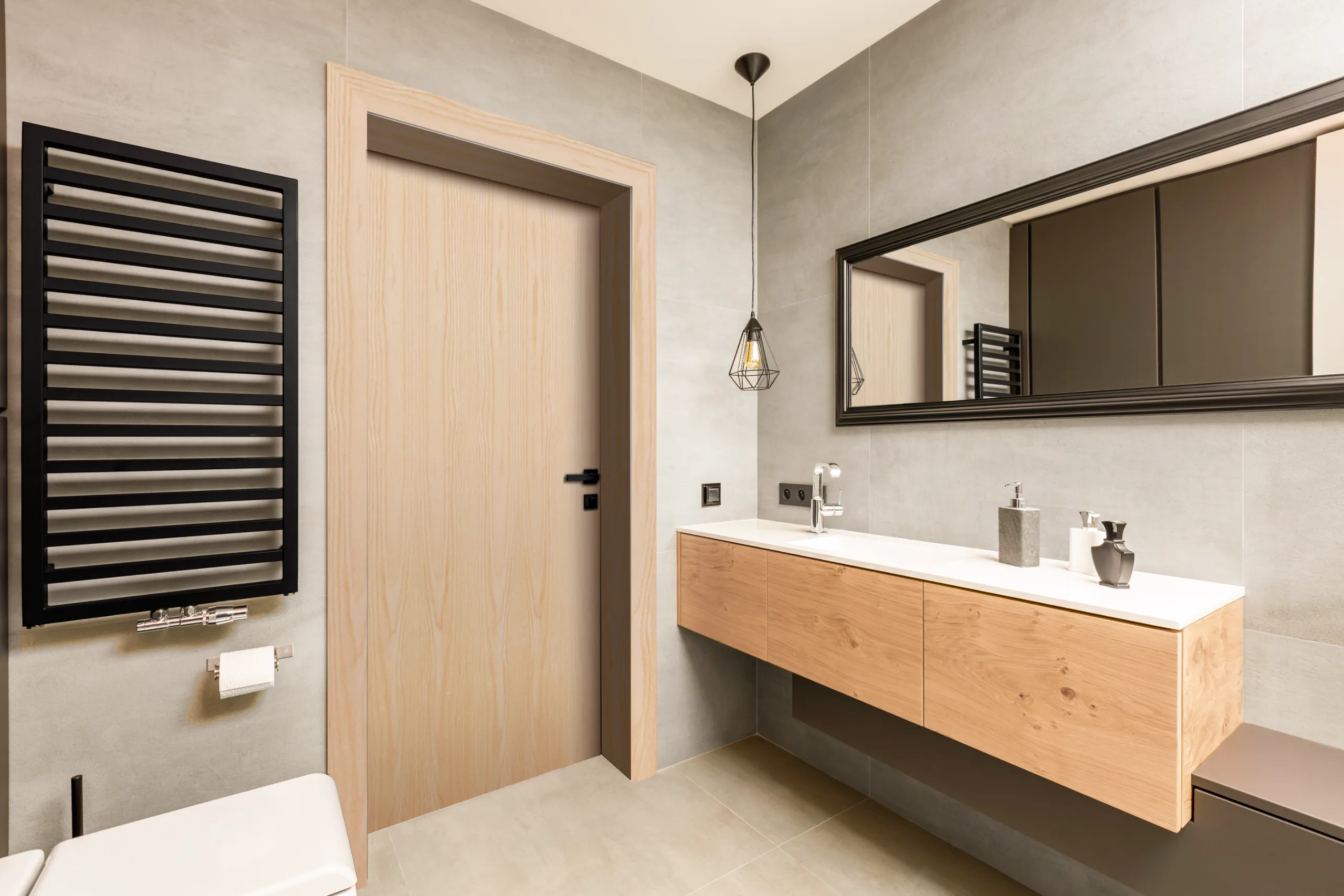 A birch flush interior door in a modern bathroom