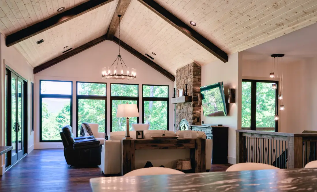 Tucker 3300 Series black vinyl windows and transoms under a vaulted great room ceiling